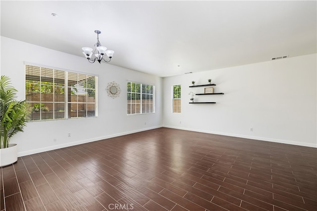 17129 Lacebark St, Fontana, CA 92337 - unfurnished living room with a chandelier and dark wood-type flooring