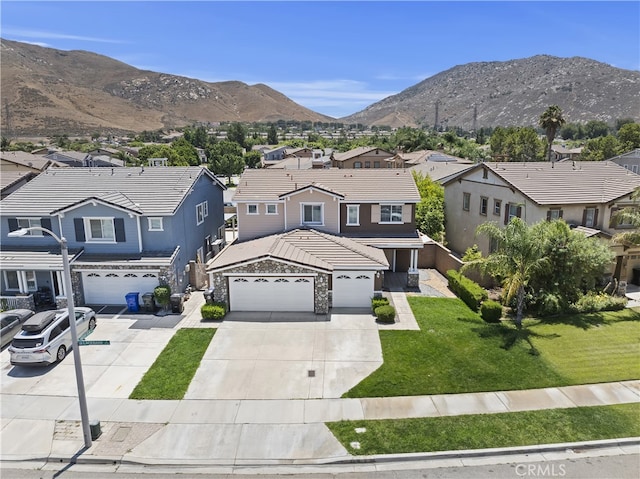 17129 Lacebark St, Fontana, CA 92337 - view of front of house featuring a residential view, driveway, a tile roof, and a mountain view