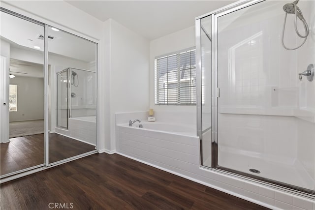 17129 Lacebark St, Fontana, CA 92337 - full bath featuring a shower stall, wood finished floors, a garden tub, and healthy amount of natural light