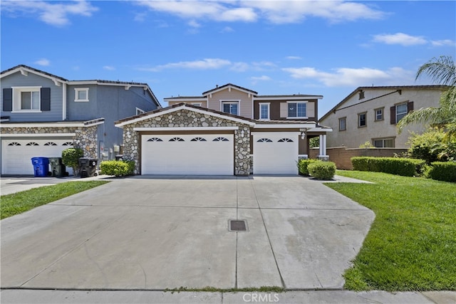 17129 Lacebark St, Fontana, CA 92337 - traditional-style house with driveway, a front yard, stone siding, and a garage