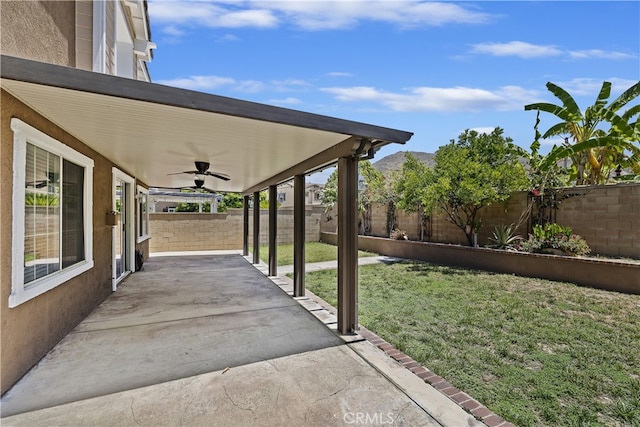 17129 Lacebark St, Fontana, CA 92337 - fenced backyard with a ceiling fan and a patio area