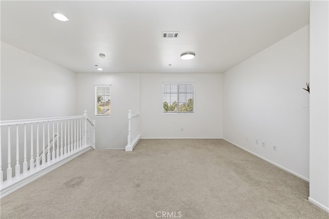 17129 Lacebark St, Fontana, CA 92337 - empty room with light colored carpet and recessed lighting