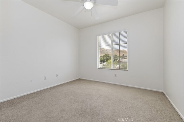 17129 Lacebark St, Fontana, CA 92337 - empty room with light carpet and a ceiling fan