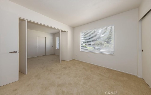 450 Marilyn Ln, Redlands, CA 92373 - unfurnished bedroom featuring light colored carpet and a closet