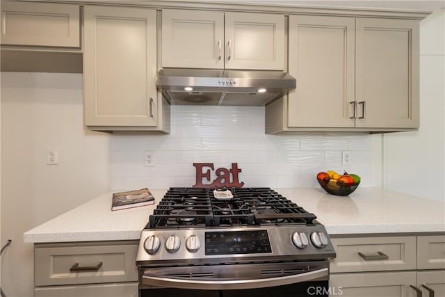 450 Marilyn Ln, Redlands, CA 92373 - kitchen featuring under cabinet range hood, gas stove, gray cabinets, and backsplash