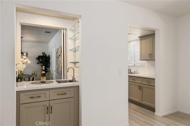 450 Marilyn Ln, Redlands, CA 92373 - bar area with a sink and light wood-style flooring