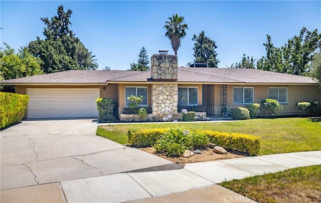 450 Marilyn Ln, Redlands, CA 92373 - ranch-style home with a chimney, an attached garage, a front lawn, driveway, and stone siding