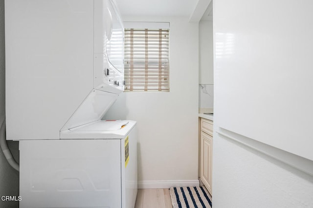 5040 Island View St, Oxnard, CA 93035 - laundry area with stacked washer / dryer and baseboards
