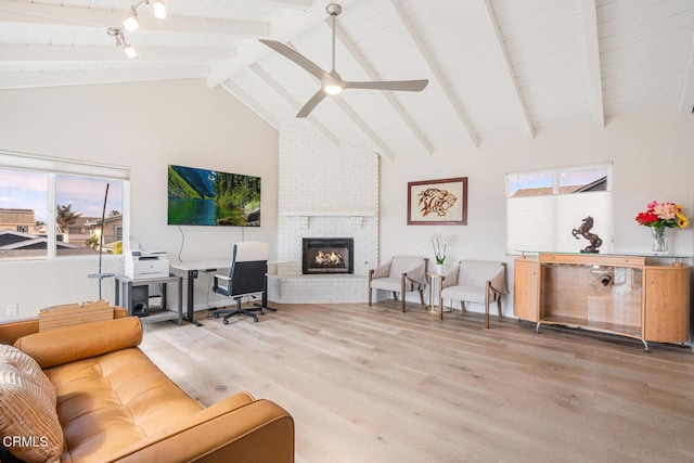 5040 Island View St, Oxnard, CA 93035 - living area with wood finished floors, beamed ceiling, a brick fireplace, a ceiling fan, and high vaulted ceiling