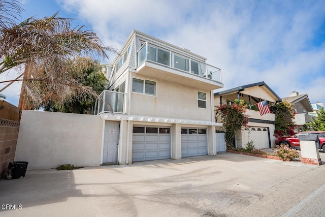 5040 Island View St, Oxnard, CA 93035 - view of front of home with an attached garage, stucco siding, and driveway
