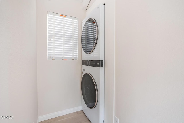 5040 Island View St, Oxnard, CA 93035 - laundry area with estacked washer and dryer and light wood-style flooring