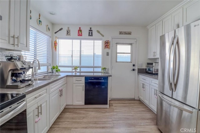 5970 Sky Meadow St, Jurupa Valley, CA 92509 - kitchen featuring appliances with stainless steel finishes, healthy amount of natural light, white cabinetry, and light wood-style flooring