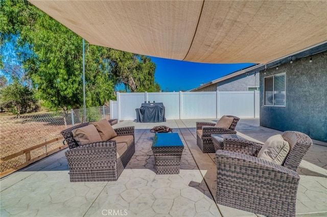 5970 Sky Meadow St, Jurupa Valley, CA 92509 - fenced backyard with an outdoor hangout area and a patio area