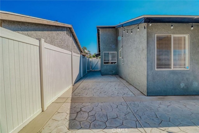 5970 Sky Meadow St, Jurupa Valley, CA 92509 - view of side of property featuring a patio area and stucco siding
