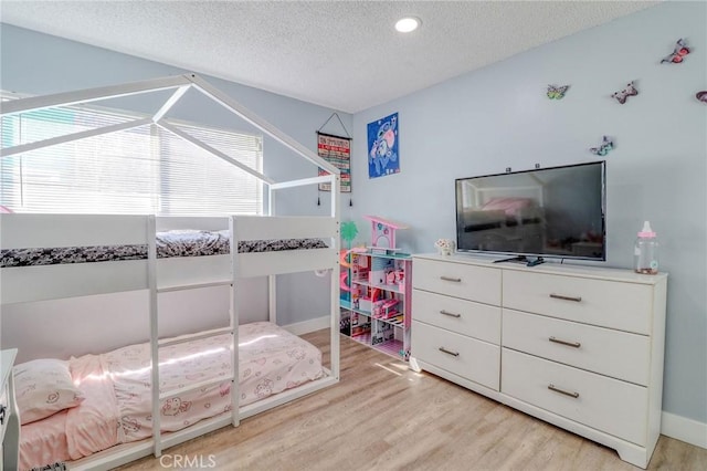 5970 Sky Meadow St, Jurupa Valley, CA 92509 - bedroom featuring a textured ceiling, light wood-style floors, and recessed lighting