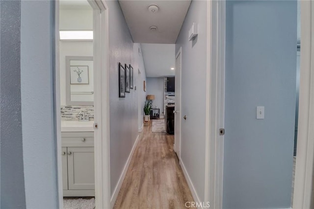 5970 Sky Meadow St, Jurupa Valley, CA 92509 - corridor with light wood-style flooring and baseboards