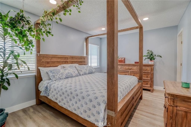 5970 Sky Meadow St, Jurupa Valley, CA 92509 - bedroom with a textured ceiling, light wood finished floors, and recessed lighting
