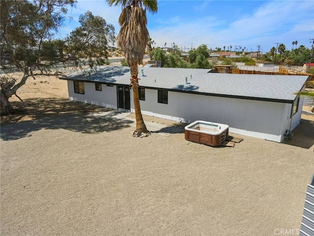5676 Aztec Ave Unit 29, Palms, CA 92277 - back of property with a shingled roof