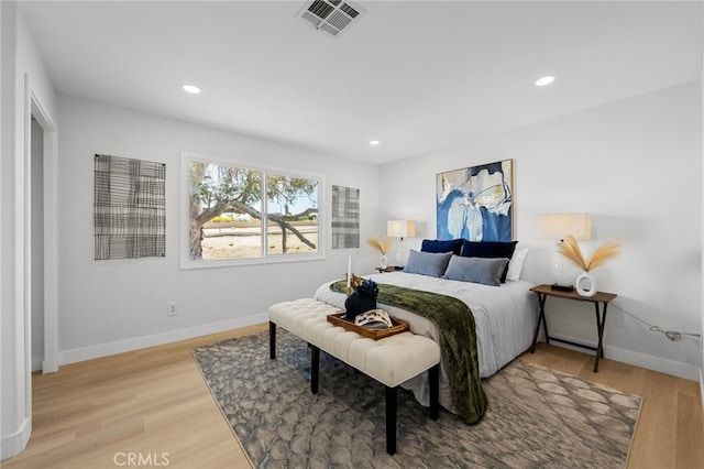 5676 Aztec Ave Unit 29, Palms, CA 92277 - bedroom featuring wood finished floors and recessed lighting