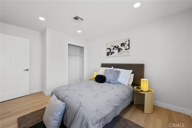 5676 Aztec Ave Unit 29, Palms, CA 92277 - bedroom featuring wood finished floors, recessed lighting, and a closet