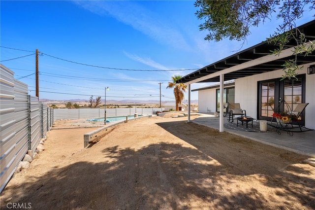 5676 Aztec Ave Unit 29, Palms, CA 92277 - view of yard featuring a patio