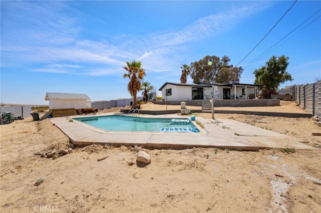 5676 Aztec Ave Unit 29, Palms, CA 92277 - view of swimming pool featuring a fenced backyard and a patio