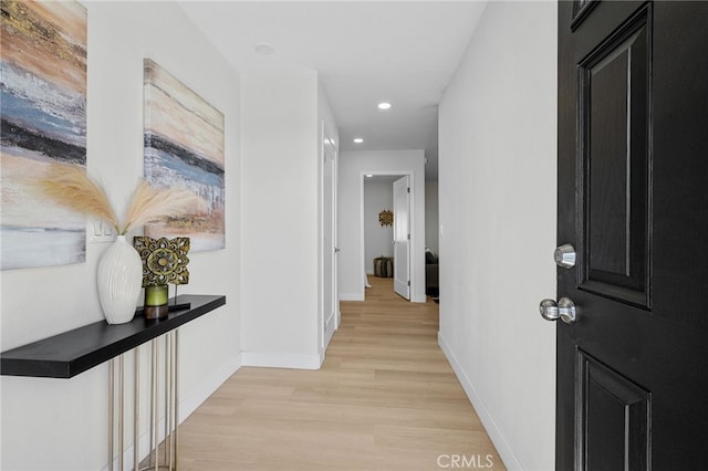 5676 Aztec Ave Unit 29, Palms, CA 92277 - hallway featuring light wood finished floors and recessed lighting