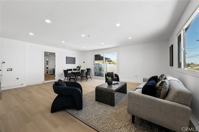 5676 Aztec Ave Unit 29, Palms, CA 92277 - living area featuring light wood-type flooring and recessed lighting
