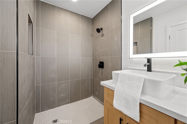 5676 Aztec Ave Unit 29, Palms, CA 92277 - bathroom featuring vanity and a tile shower