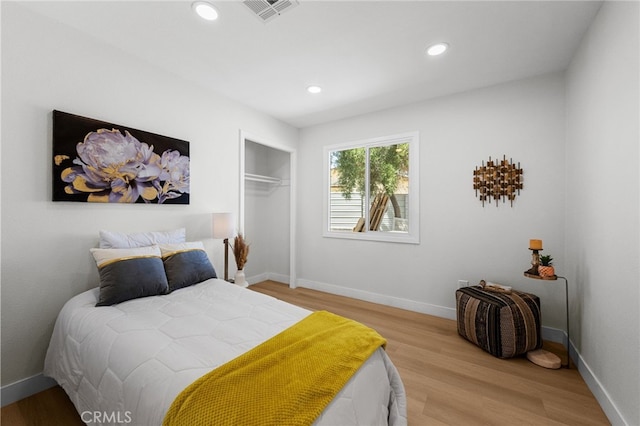 5676 Aztec Ave Unit 29, Palms, CA 92277 - bedroom featuring light wood-style flooring, a closet, and recessed lighting