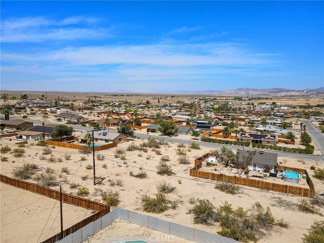 5676 Aztec Ave Unit 29, Palms, CA 92277 - aerial perspective of suburban area with a mountain backdrop and a desert landscape