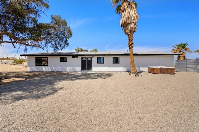 5676 Aztec Ave Unit 29, Palms, CA 92277 - rear view of property featuring a hot tub
