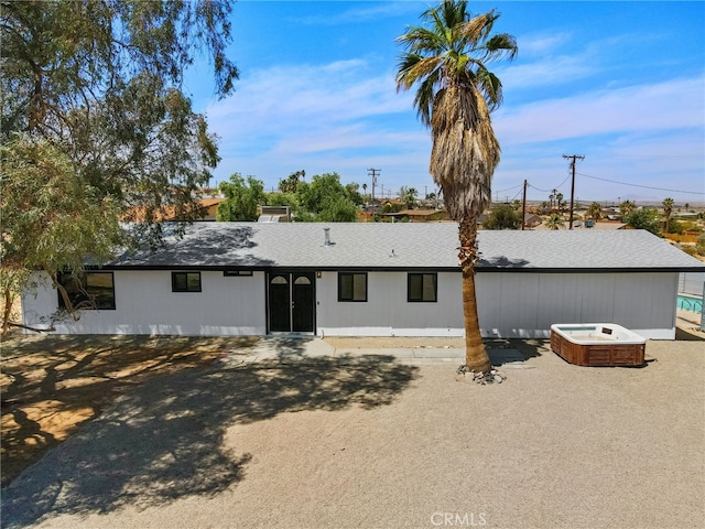 5676 Aztec Ave Unit 29, Palms, CA 92277 - rear view of property featuring a hot tub