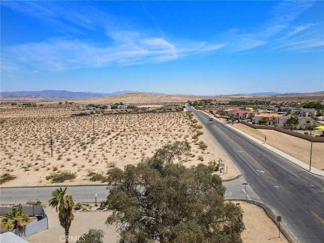 5676 Aztec Ave Unit 29, Palms, CA 92277 - aerial view of residential area featuring a mountain backdrop and a desert landscape