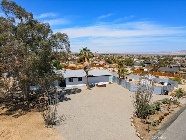 5676 Aztec Ave Unit 29, Palms, CA 92277 - view of front of house with a mountain view and a residential view