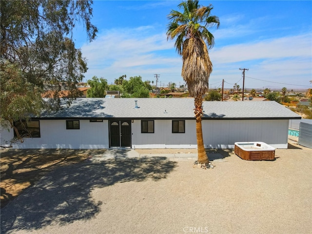 5676 Aztec Ave Unit 29, Palms, CA 92277 - rear view of house with a hot tub