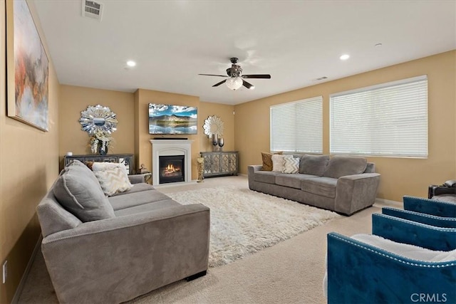 4106 Irish Moss Ln, San Bernardino, CA 92407 - carpeted living area featuring ceiling fan, a warm lit fireplace, and recessed lighting