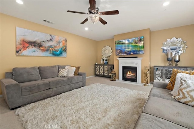 4106 Irish Moss Ln, San Bernardino, CA 92407 - carpeted living area with a ceiling fan, recessed lighting, and a glass covered fireplace