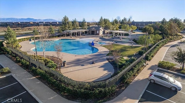 4106 Irish Moss Ln, San Bernardino, CA 92407 - view of swimming pool featuring a pergola, a patio area, a pool with connected hot tub, and a mountain view