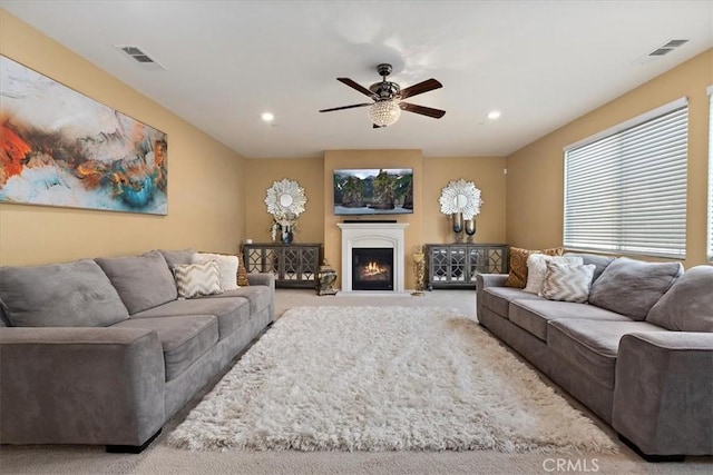 4106 Irish Moss Ln, San Bernardino, CA 92407 - living room with carpet, recessed lighting, a ceiling fan, and a lit fireplace