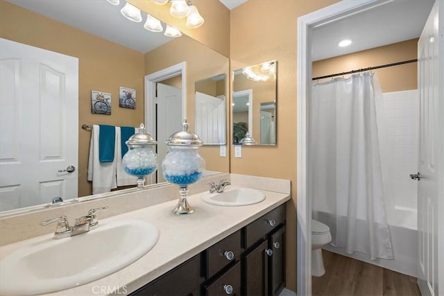 4106 Irish Moss Ln, San Bernardino, CA 92407 - bathroom with double vanity, shower / tub combo, and wood finished floors