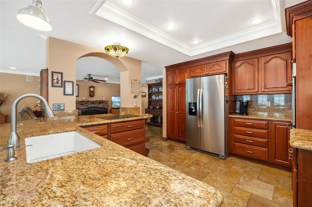 25572 Orchard Rim Ln, Lake Forest, CA 92630 - kitchen featuring stainless steel fridge, ceiling fan, crown molding, stone tile floors, and backsplash