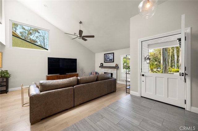 24932 Dove Tree Ln, Lake Forest, CA 92630 - living area featuring ceiling fan, high vaulted ceiling, light wood finished floors, and a fireplace