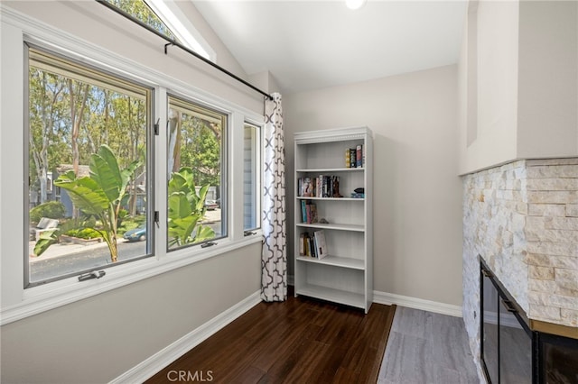 24932 Dove Tree Ln, Lake Forest, CA 92630 - unfurnished room featuring a fireplace, wood finished floors, healthy amount of natural light, and lofted ceiling