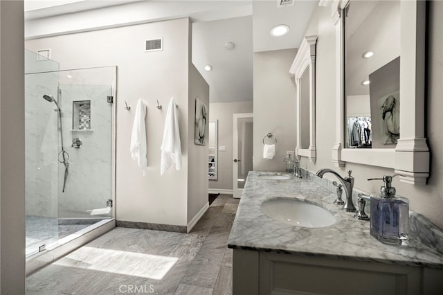 24932 Dove Tree Ln, Lake Forest, CA 92630 - full bathroom featuring a marble finish shower, double vanity, recessed lighting, and marble look tile flooring