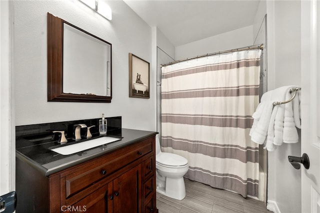 24932 Dove Tree Ln, Lake Forest, CA 92630 - bathroom with vanity, a shower with shower curtain, and wood finished floors