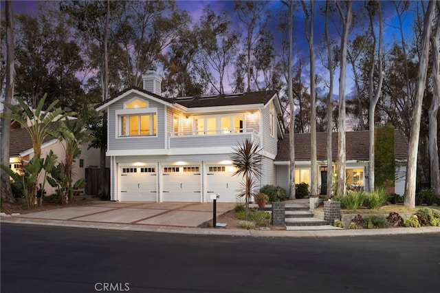 24932 Dove Tree Ln, Lake Forest, CA 92630 - view of front of home with driveway, a garage, and a chimney
