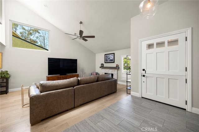 24932 Dove Tree Ln, Lake Forest, CA 92630 - living area featuring a ceiling fan, light wood-style flooring, high vaulted ceiling, and a fireplace