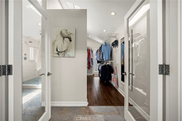 24932 Dove Tree Ln, Lake Forest, CA 92630 - corridor with french doors, recessed lighting, vaulted ceiling, and stone finish flooring