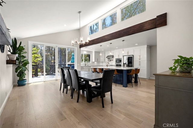 24932 Dove Tree Ln, Lake Forest, CA 92630 - dining space featuring high vaulted ceiling, a chandelier, light wood-style floors, and recessed lighting